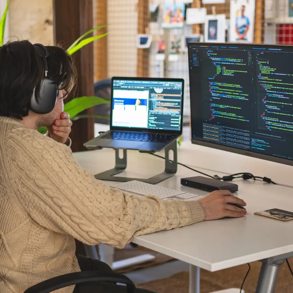 developer Logan sat at desk coding