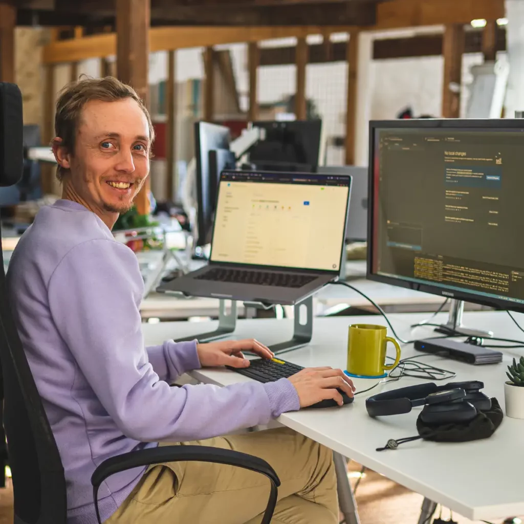 developer Lyle sat at desk coding