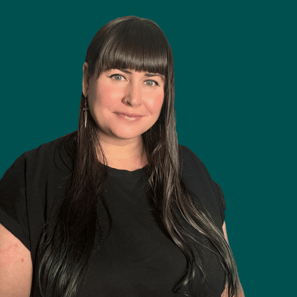Lyssa-Fêe Crump Hiyield headshot on green background.