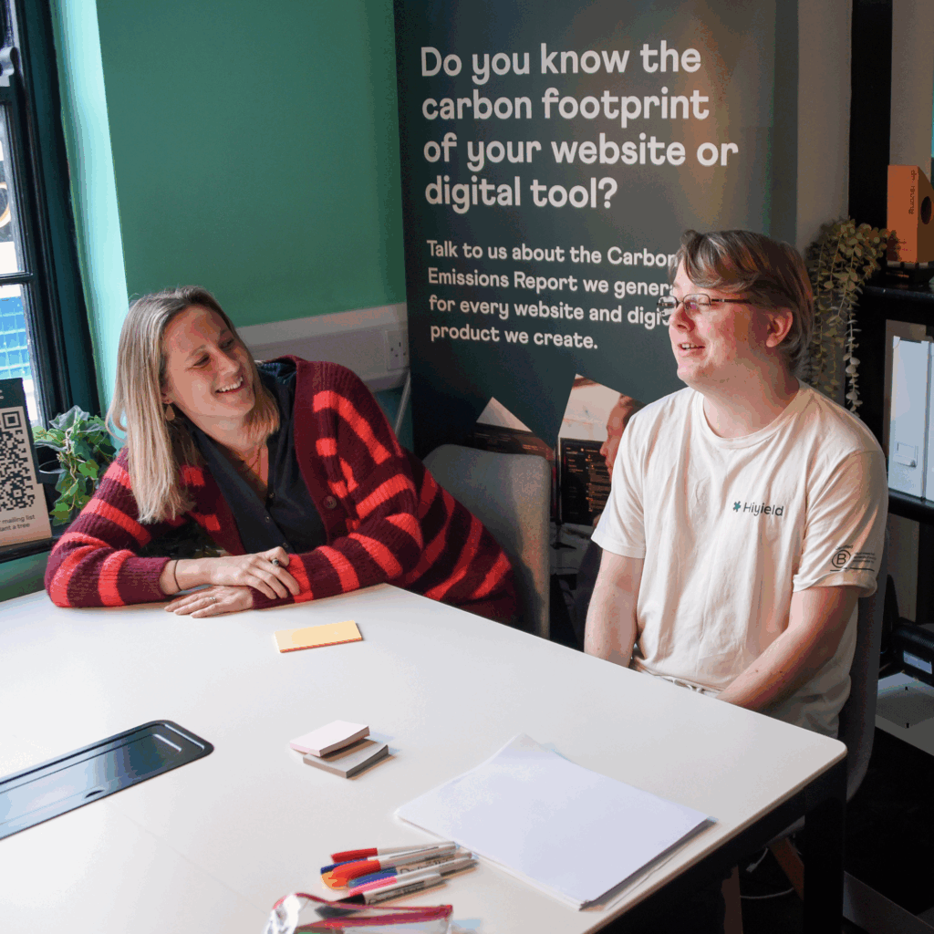 Laura and Ben sat at a meeting table