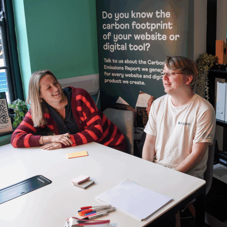 Laura and Ben sat at a meeting table