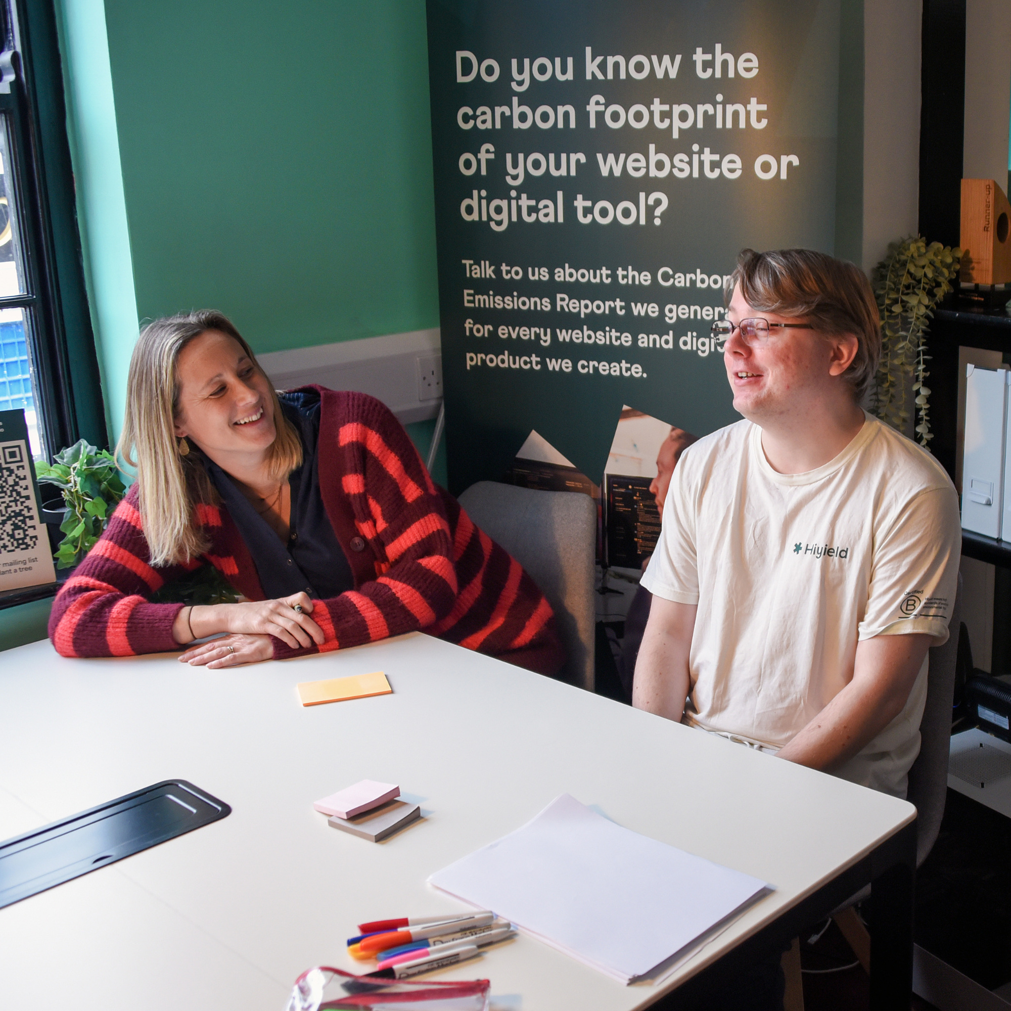 Laura and Ben sat at a meeting table