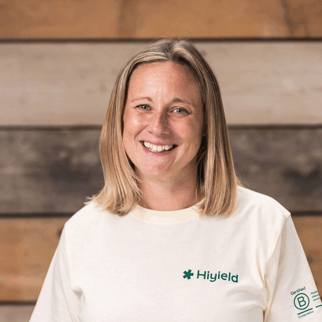 Laura Hudspith wearing a cream Hiyield B Corp t-shirt.
