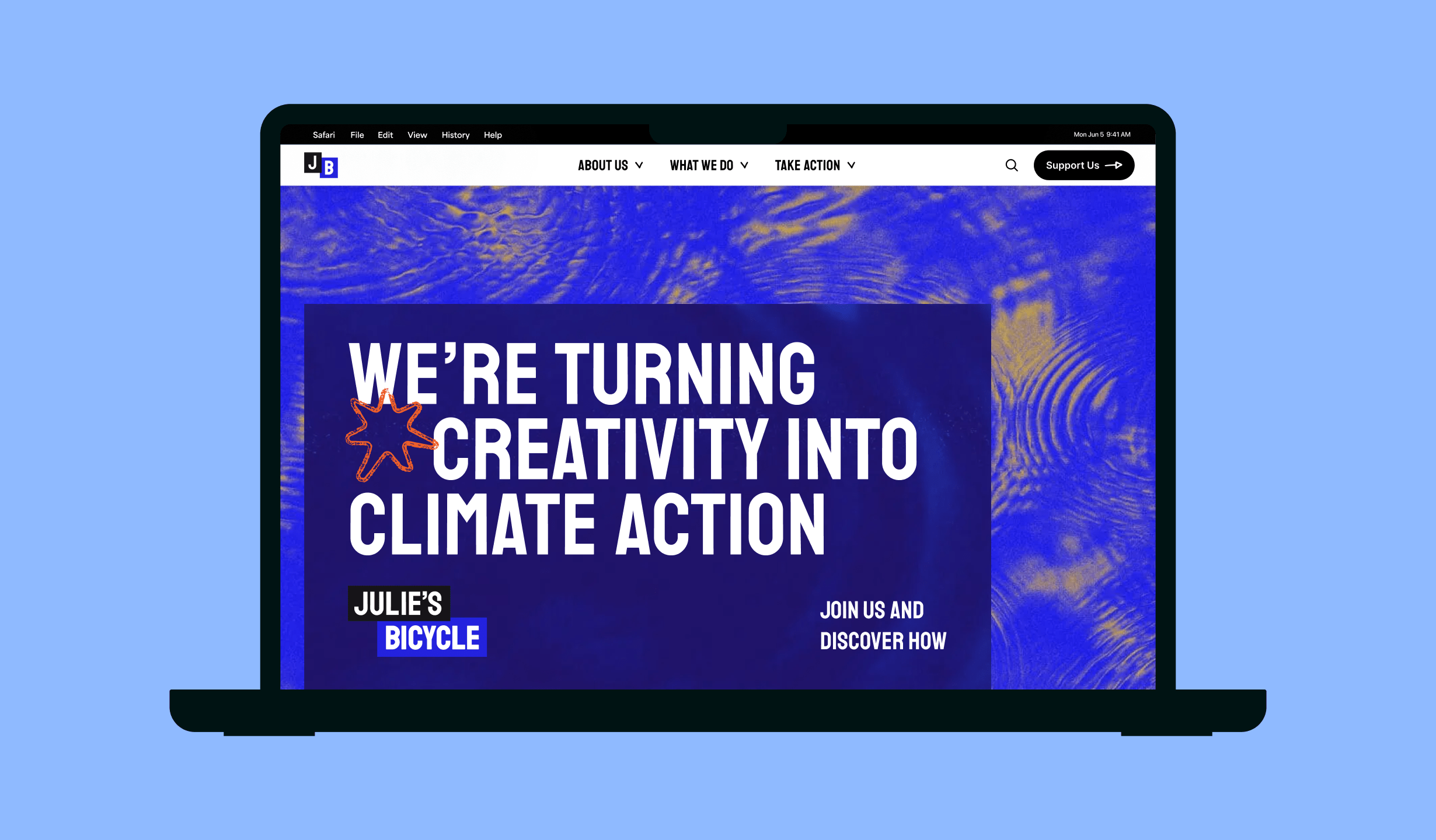 Julie's Bicycle website homepage displayed on a laptop: we're turning creativity into climate action.