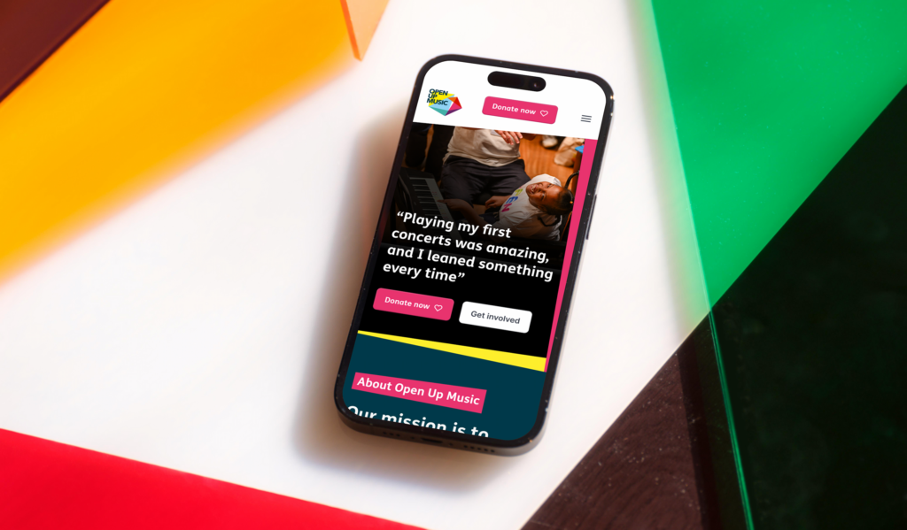The Open Up Music website displayed on a phone.